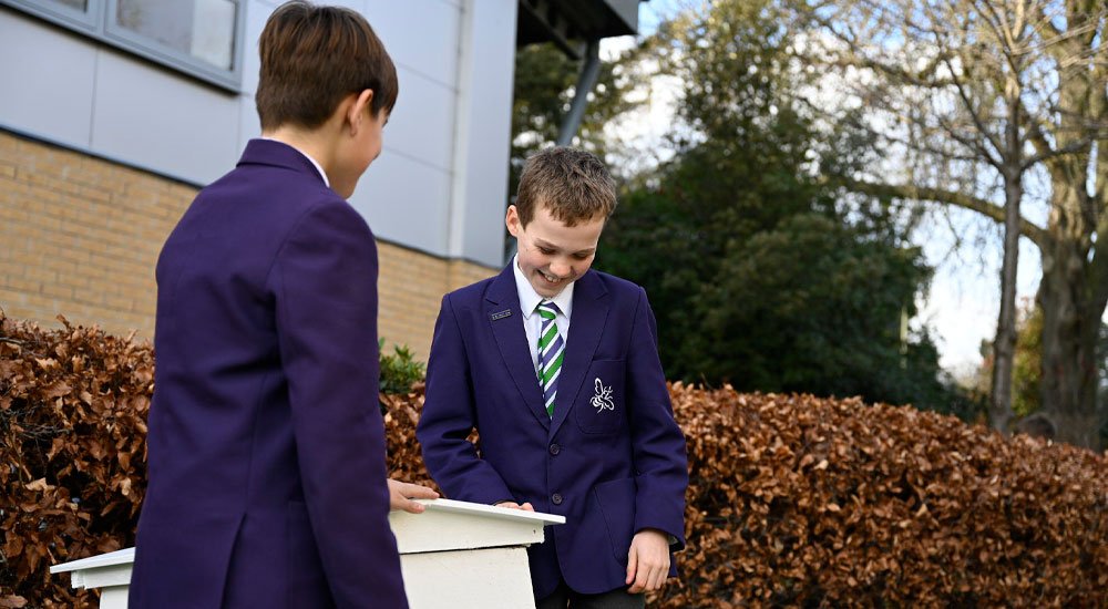 2 pupils at Bickley Park School with a beehive